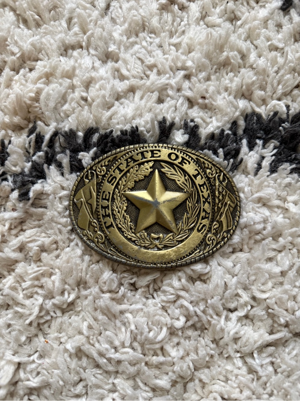 Brass-colored Texas State Seal belt buckle.